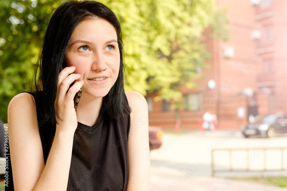 technology, communication and people concept - happy young woman calling on smartphone and laughing in cafe