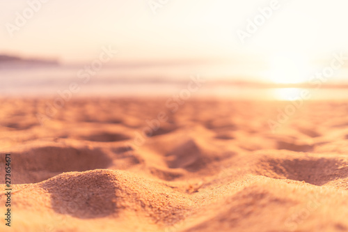 Fototapeta Naklejka Na Ścianę i Meble -  Copy space of soft sand sea and blur tropical beach with sunset sky and cloud abstract background.
