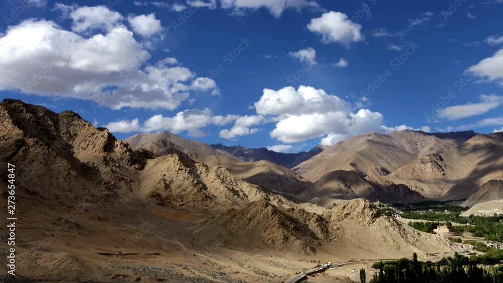 4K Time lapse in high-mountain region with clouds rolling by over sky creating shadows on hills 4K Time lapse in high-mountain region with clouds rolling by over sky creating shadows on hills