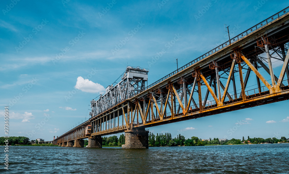 Old metal bridge across the Dnieper River in Eastern Europe, Ukraine Old metal bridge across the Dnieper River in Eastern Europe, Ukraine
