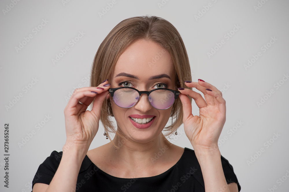 Portrait of happy young woman in stylish spectacles Portrait of happy young woman in stylish spectacles
