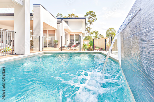 Wallpaper Mural Swimming pool design with water and house garden. Torontodigital.ca