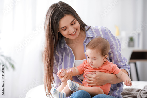 Happy mother with adorable ...