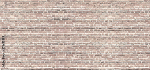 Panoramic background of wide beige brick wall texture. Home or office design backdrop