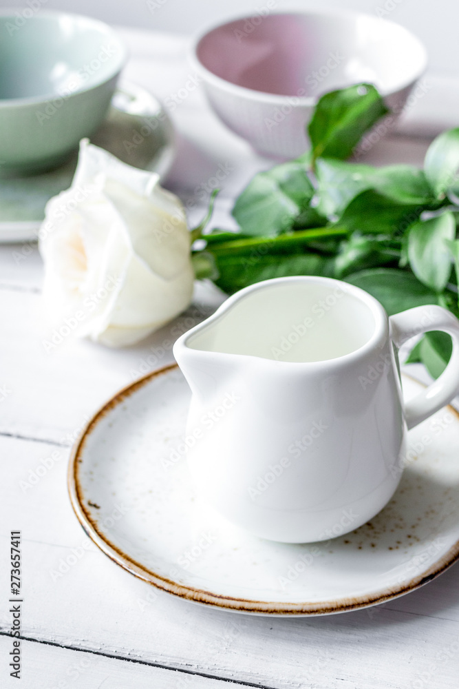 ceramic tableware with flowers on white background ceramic tableware with flowers on white background