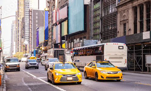 Canvas Print New York, streets. High buildings, colorful signs, cars and cabs