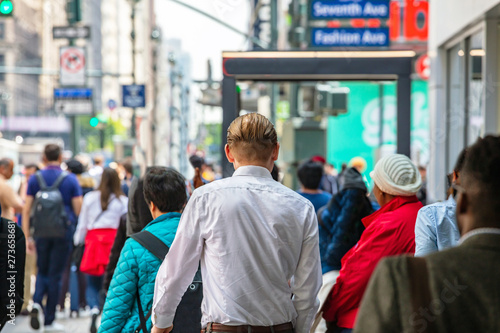 New York, streets. High buildings and crowd walking