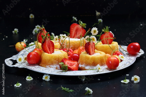 Cupcakes with berry cream on a black background photo