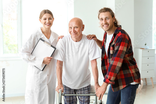 Young man visiting his elde...