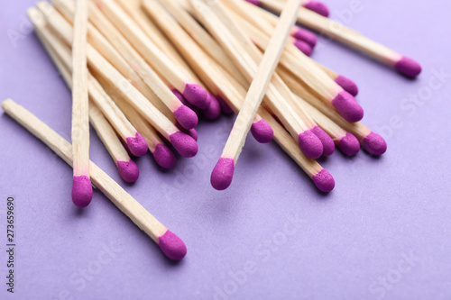 Many matches on color background photo