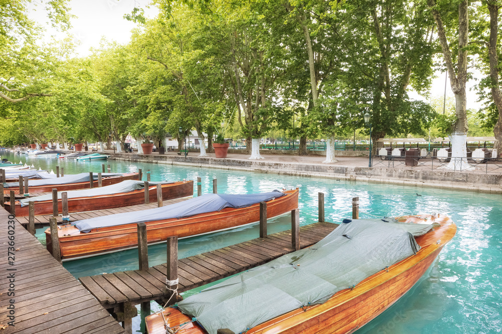 Wooden boats moored on of Thiou river canal in Annecy, France