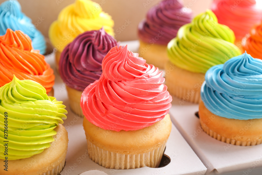 Many tasty colorful cupcakes in box Many tasty colorful cupcakes in box