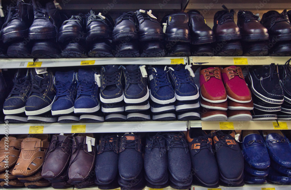 Variety shoe for man display on shelf in the store.