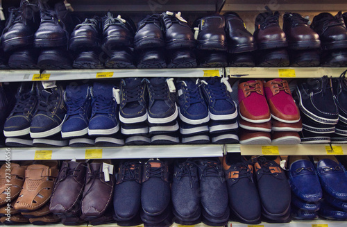 Variety shoe for man display on shelf in the store.