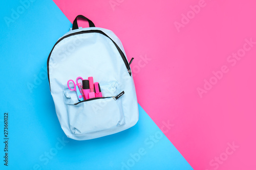 Obraz na płótnie School backpack with stationery on color background