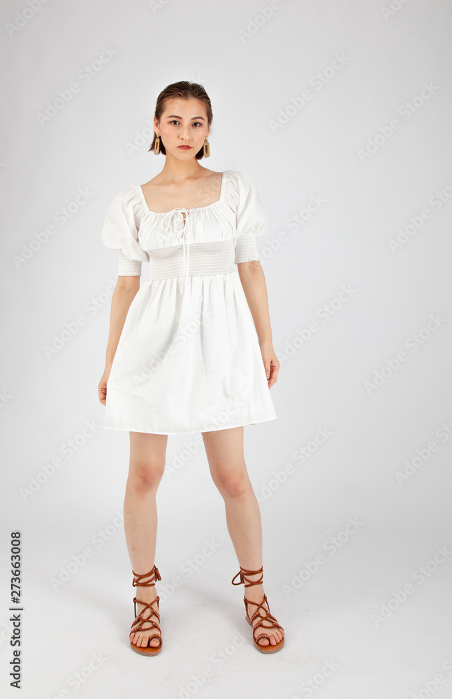 Asian Chinese Fashion influencer modeling in white dress isolated in white  background Stock-Foto | Adobe Stock