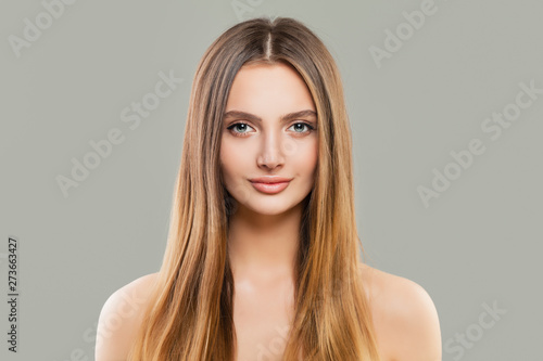 Healthy woman portrait. Beautiful model with clear skin and long shiny brown hair
