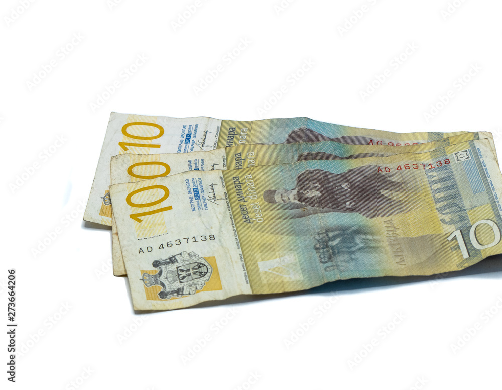 Three banknotes worth 10 Serbian Dinars with a portrait of a Linguist Vuk Karadzic isolated on a white background Three banknotes worth 10 Serbian Dinars with a portrait of a Linguist Vuk Karadzic isolated on a white background