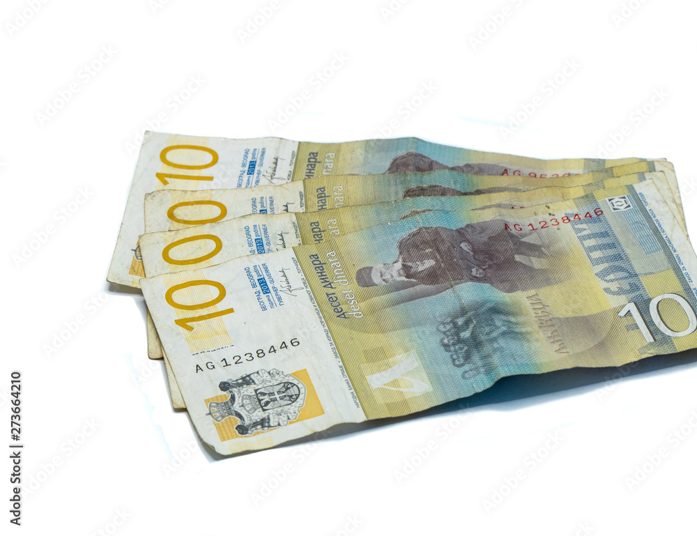 Four banknotes worth 10 Serbian Dinars with a portrait of a Linguist Vuk Karadzic isolated on a white background Four banknotes worth 10 Serbian Dinars with a portrait of a Linguist Vuk Karadzic isolated on a white background