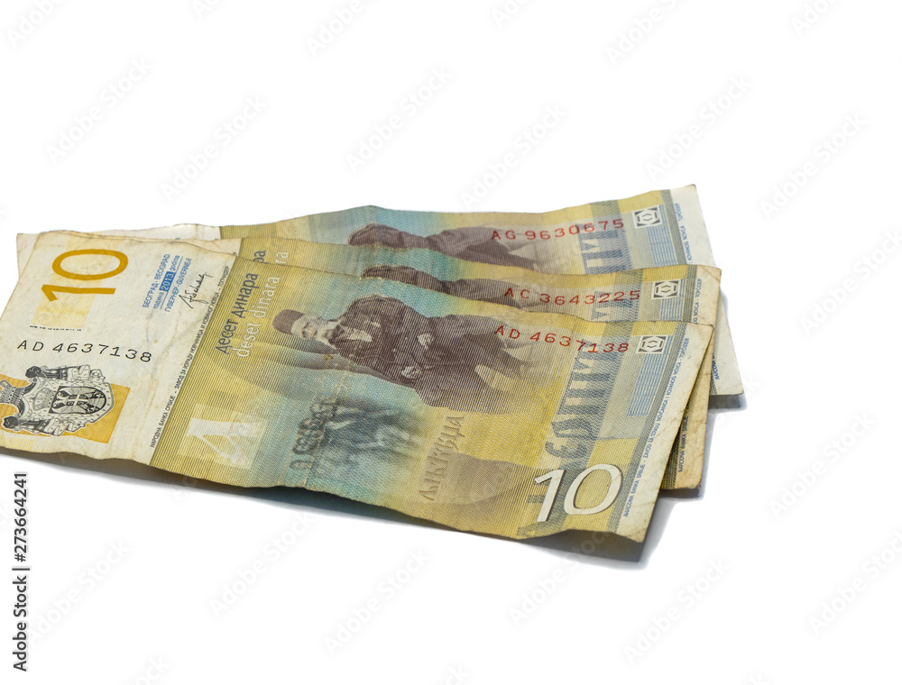 Three banknotes worth 10 Serbian Dinars with a portrait of a Linguist Vuk Karadzic isolated on a white background Three banknotes worth 10 Serbian Dinars with a portrait of a Linguist Vuk Karadzic isolated on a white background