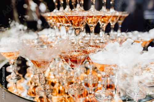 Beautiful Composition from Glasses with Champagne. Goblet with Smoking Alcoholic Beverage Tower. Special Decoration Element for Celebrating Wedding or Engagement. Catering Service and Restaurant Party