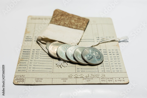 Thai currency, coin type and bank passbook long ago. photo