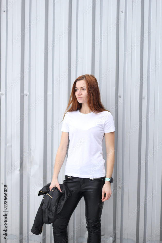Red hair girl in white t-shirt. Street style. Advertising brand clothing. Fashion Shooting. Mockup. Red hair girl in white t-shirt. Street style. Advertising brand clothing. Fashion Shooting. Mockup.