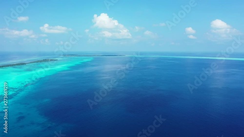 Wallpaper Mural Drone going backwards looking over the Beautiful Landscape,  with the coral reef in the water. Torontodigital.ca