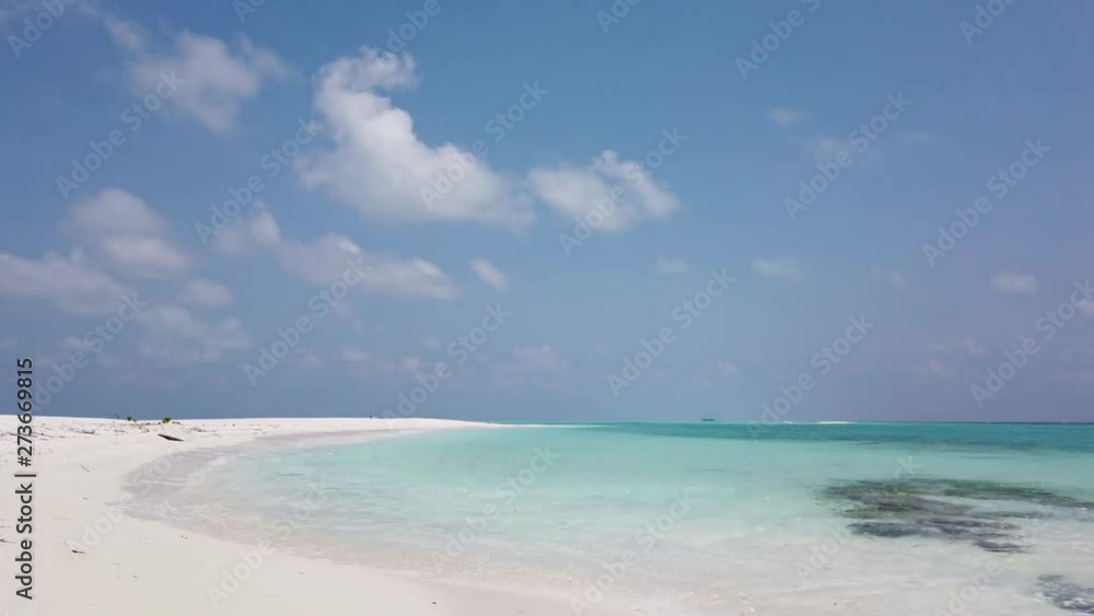 Thailand: camera moving from a small bay with white sand washed by the pure waters of the ocean to the sky with scattered clouds in the distance Thailand: camera moving from a small bay with white sand washed by the pure waters of the ocean to the sky with scattered clouds in the distance