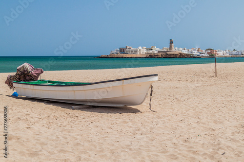 Fishing boat on a beach in Sur, Oman © Matyas Rehak