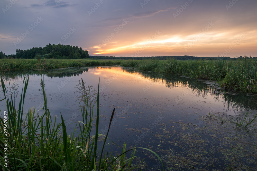 Sunrise over the backwaters Luciaza river near Sulejow, Lodzkie, Poand Sunrise over the backwaters Luciaza river near Sulejow, Lodzkie, Poand