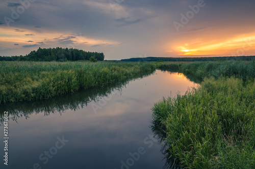 Sunrise over the backwaters Luciaza river near Sulejow, Lodzkie, Poand
