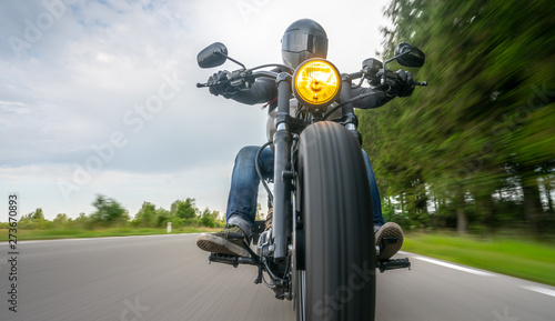 motorbike on the road riding. having fun riding the empty road on a motorcycle tour / journey