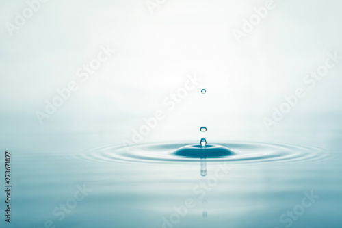 Water droplets on surface water background