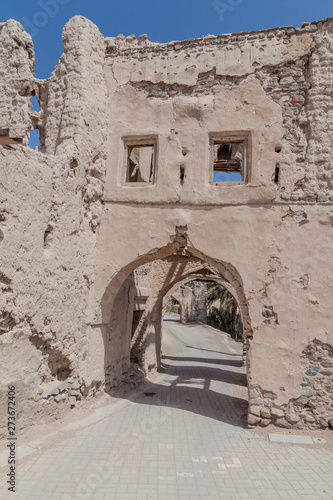 Old gate of ruined Ibra Old Quarter, Oman photo