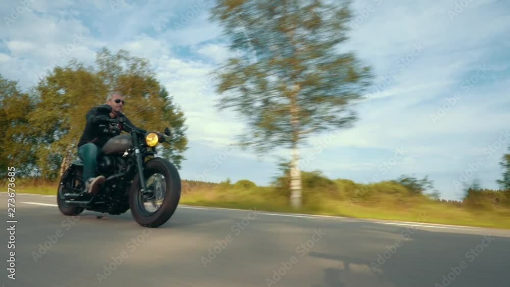 motorbike on the road riding. having fun riding the empty road on a motorcycle tour / journey motorbike on the road riding. having fun riding the empty road on a motorcycle tour / journey