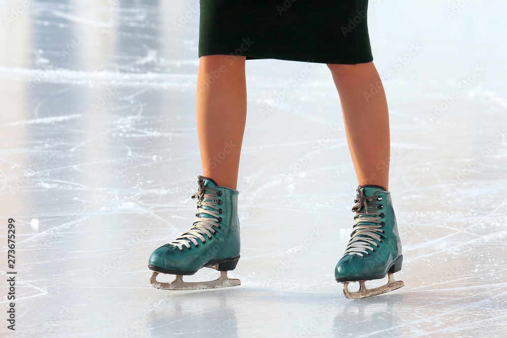 feet skating girl skating on ice rink.. sports, Hobbies and recreation of active people. feet skating girl skating on ice rink.. sports, Hobbies and recreation of active people.
