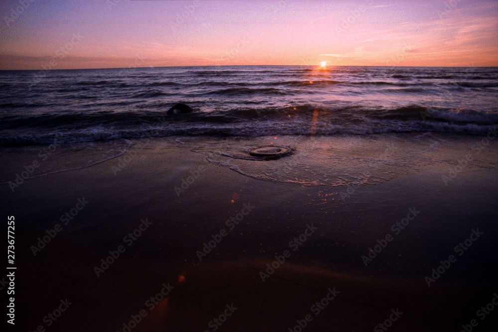 Baltic Sea sunset on film, has some grain.