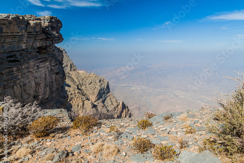 View from the rim of Jebel Shams, the tallest mountain of Oman. Military radar site in the background.