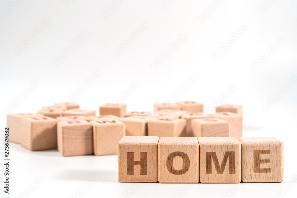Fototapeta premium word HOME on wood cube dices on white background.