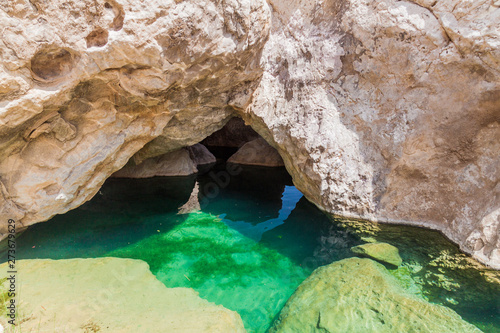 Turquoise water of a creek in Wadi Tiwi valley, Oman