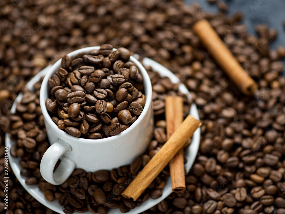 Fototapeta premium White coffee Cup filled with top quality roasted coffee beans