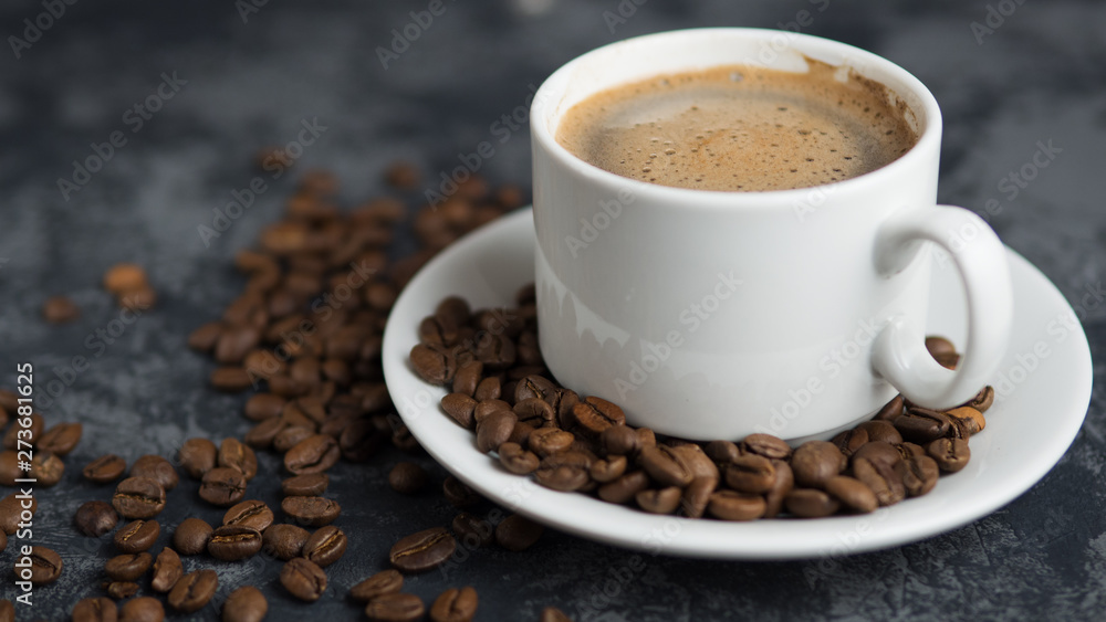 White Cup of espresso coffee with cinnamon on the copyspace concrete table White Cup of espresso coffee with cinnamon on the copyspace concrete table