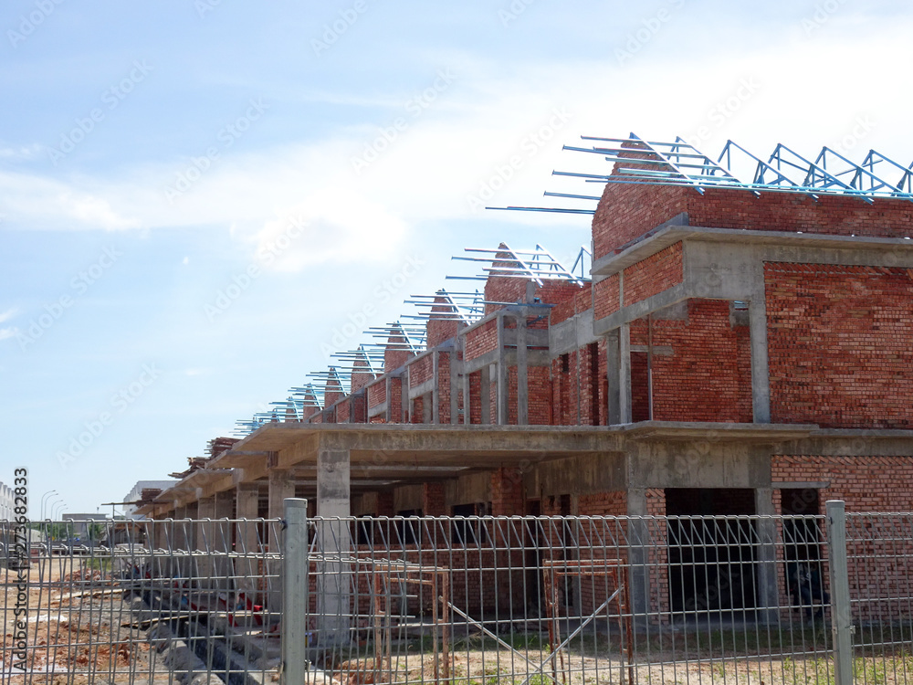 Double story luxury terrace house under construction in Malaysia. Designed by an architect with a modern and contemporary style. Double story luxury terrace house under construction in Malaysia. Designed by an architect with a modern and contemporary style.