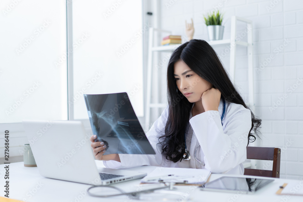 female medicine doctor explains to patient diagnosis pointing with tablets to x-ray picture. Patients listening carefully specialist recommendations. Medical care concept. Radiologist traumatologist female medicine doctor explains to patient diagnosis pointing with tablets to x-ray picture. Patients listening carefully specialist recommendations. Medical care concept. Radiologist traumatologist
