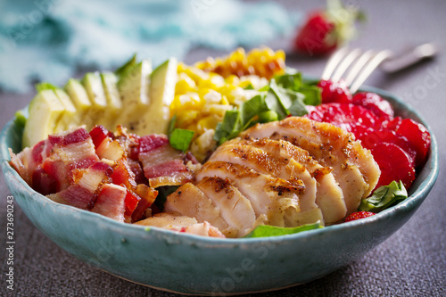 Chicken Cobb Salad. Chicken bacon avocado strawberry and sweet corn salad - healthy food photo