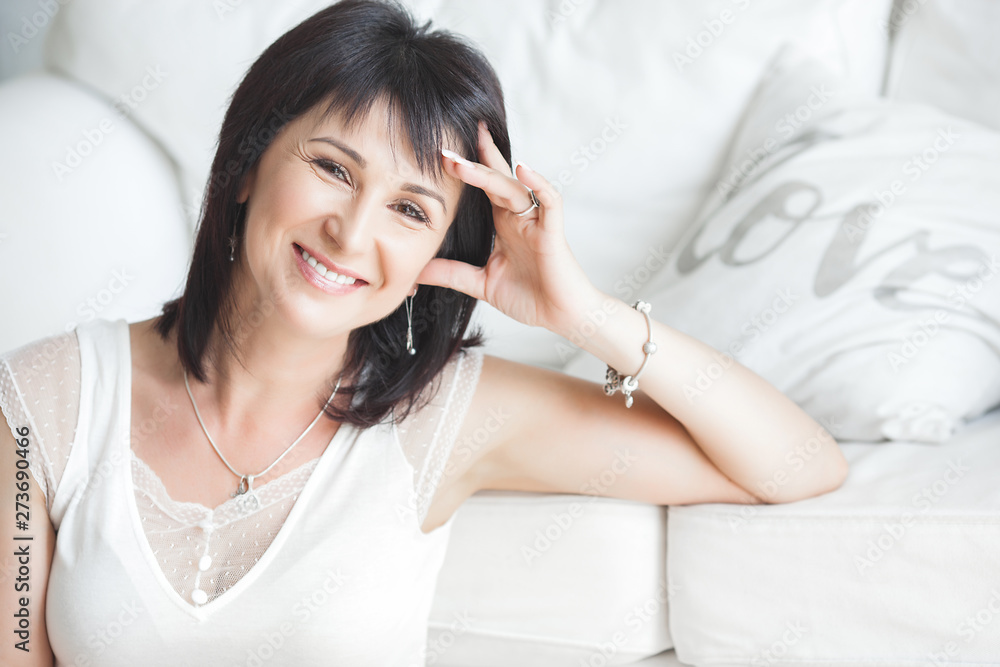 Closeup portrait of beautiful mature woman. Mid adult lady indoors. Smiling woman. Attractive female. Closeup portrait of beautiful mature woman. Mid adult lady indoors. Smiling woman. Attractive female.