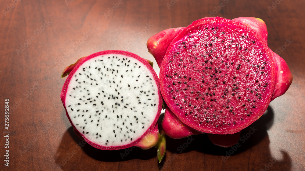 delicious dragon fruit in a cut and completely red and white delicious dragon fruit in a cut and completely red and white