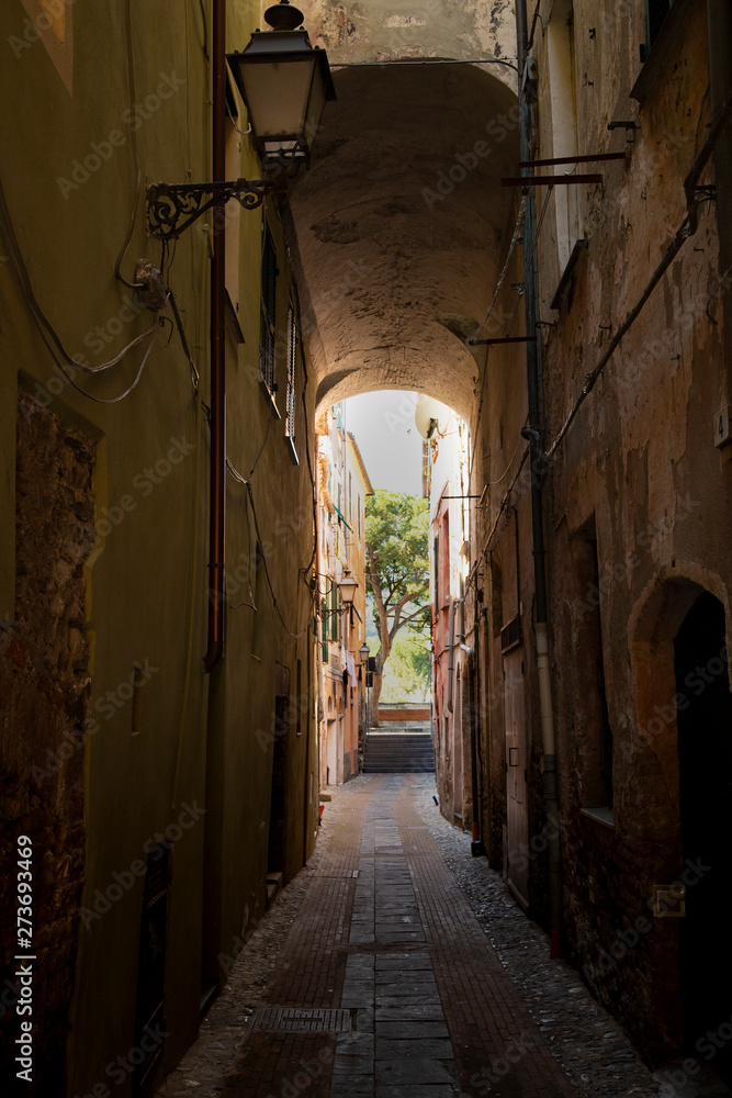 Picturesque narrow alley in Albenga, italy.