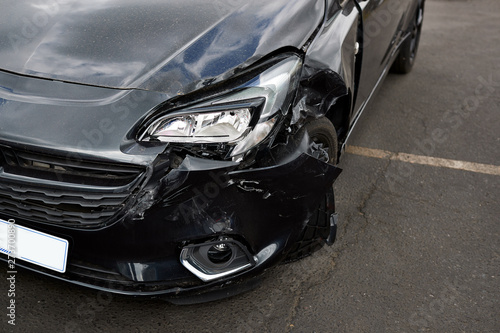 Картината върху платно Detail Of Damage To Headlight Of Vehicle In Car Park